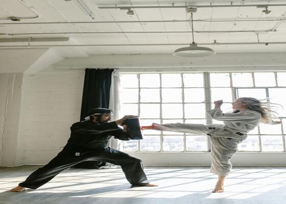 Woman kicking Pads